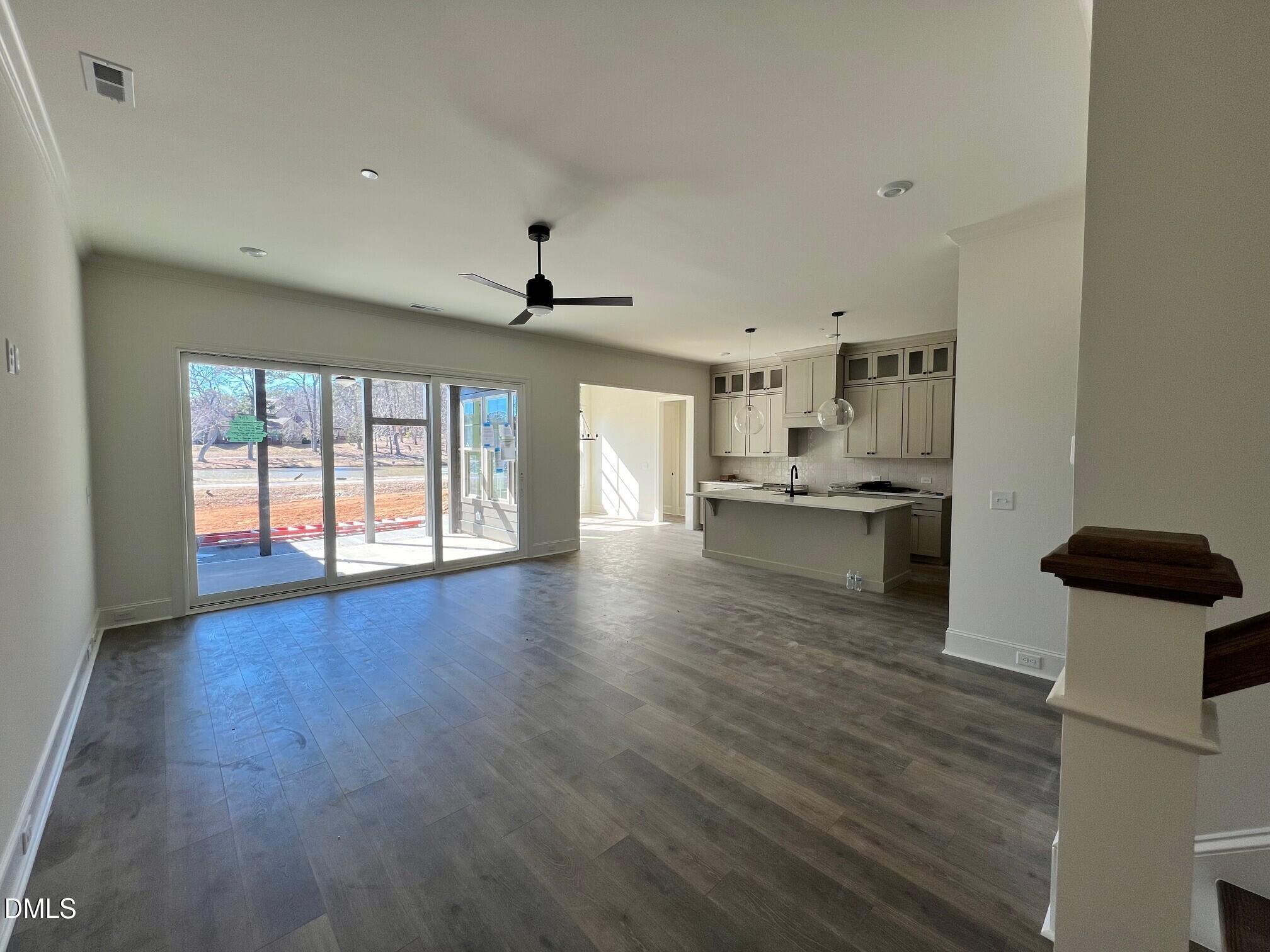 1005 Coldspring Circle Durham, NC 27705 - Photo 3 of 21 a view of a kitchen with a sink and wooden floor
