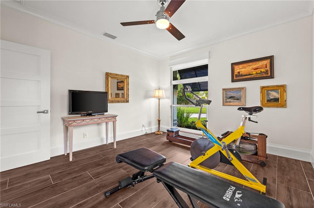2003 Duke Drive Naples, FL 34110 - Photo 28 of 49 a room with furniture and a flat screen tv
