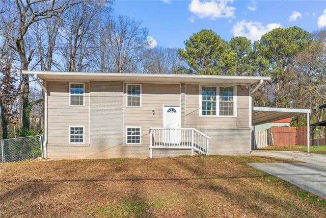 a house with trees in the background