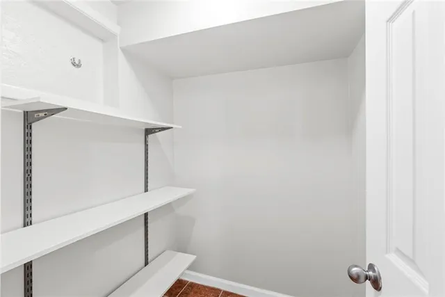 a view of a room with drop ceiling windows