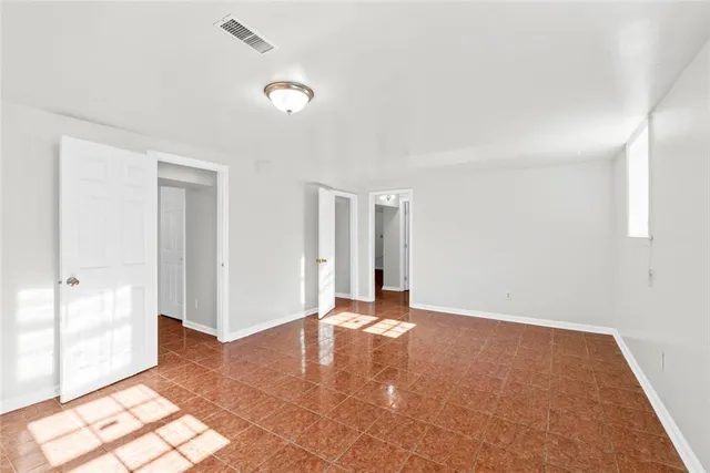 a view of a yard with a large tree