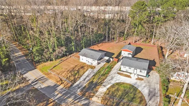 an aerial view of a house with a yard