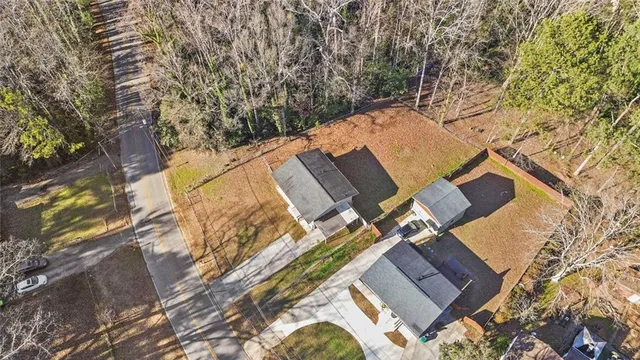 a aerial view of a house with swimming pool