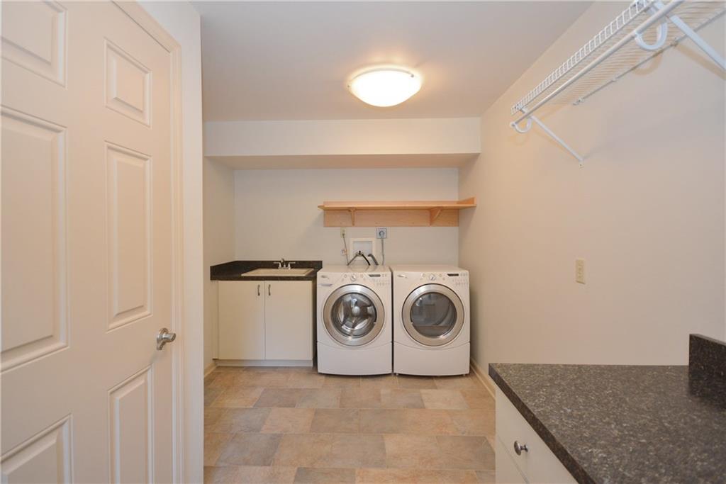 207 Springhouse Lane Pittsburgh, PA 15238 - Photo 22 of 25 Convenient 1st floor, large laundry/mudroom with door to outside.
