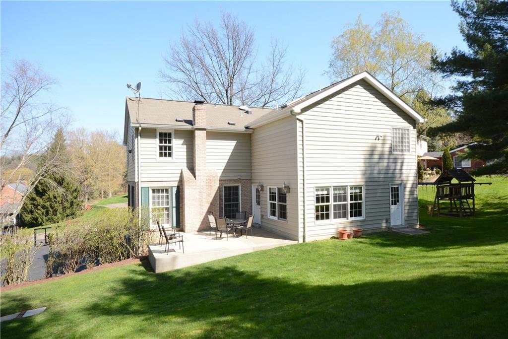 207 Springhouse Lane Pittsburgh, PA 15238 - Photo 23 of 25 Rear view of the home and it's great patio.