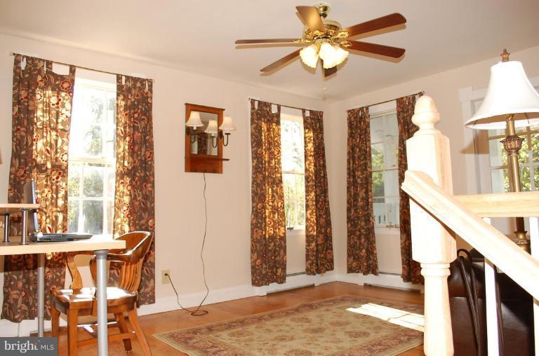 8448 Mercer Road Baldwin, MD 21013 - Photo 11 of 17 a view of a livingroom with furniture and chandelier fan