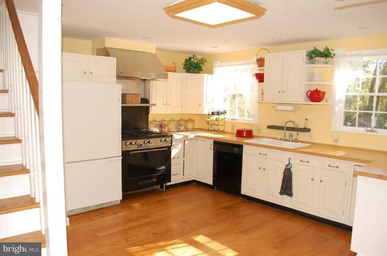8448 Mercer Road Baldwin, MD 21013 - Photo 14 of 17 a kitchen with a sink stove and refrigerator