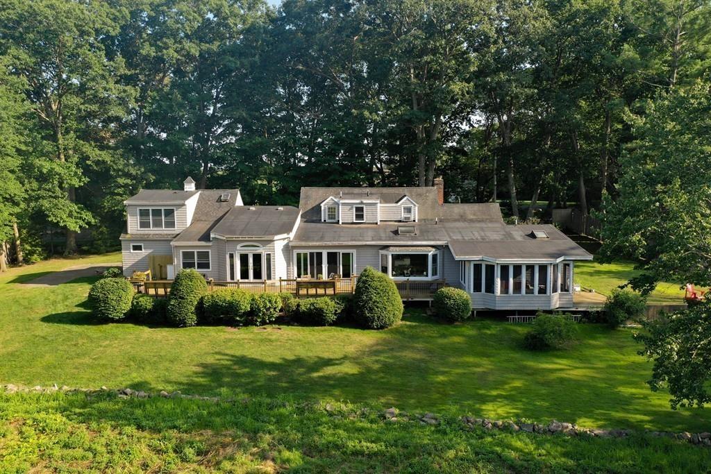 130 Argilla Road Ipswich, MA 01938 - Photo 1 of 42 a front view of a house with garden and trees