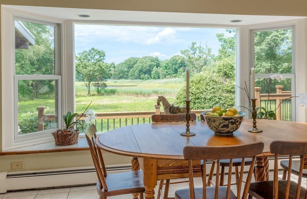 130 Argilla Road Ipswich, MA 01938 - Photo 13 of 42 a view of a dining room with furniture window and outside view