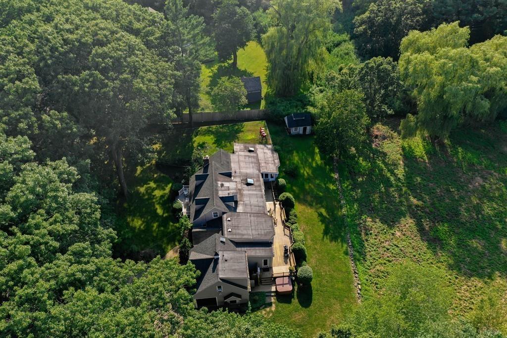 130 Argilla Road Ipswich, MA 01938 - Photo 39 of 42 an aerial view of a house with outdoor space seating area and trees all around