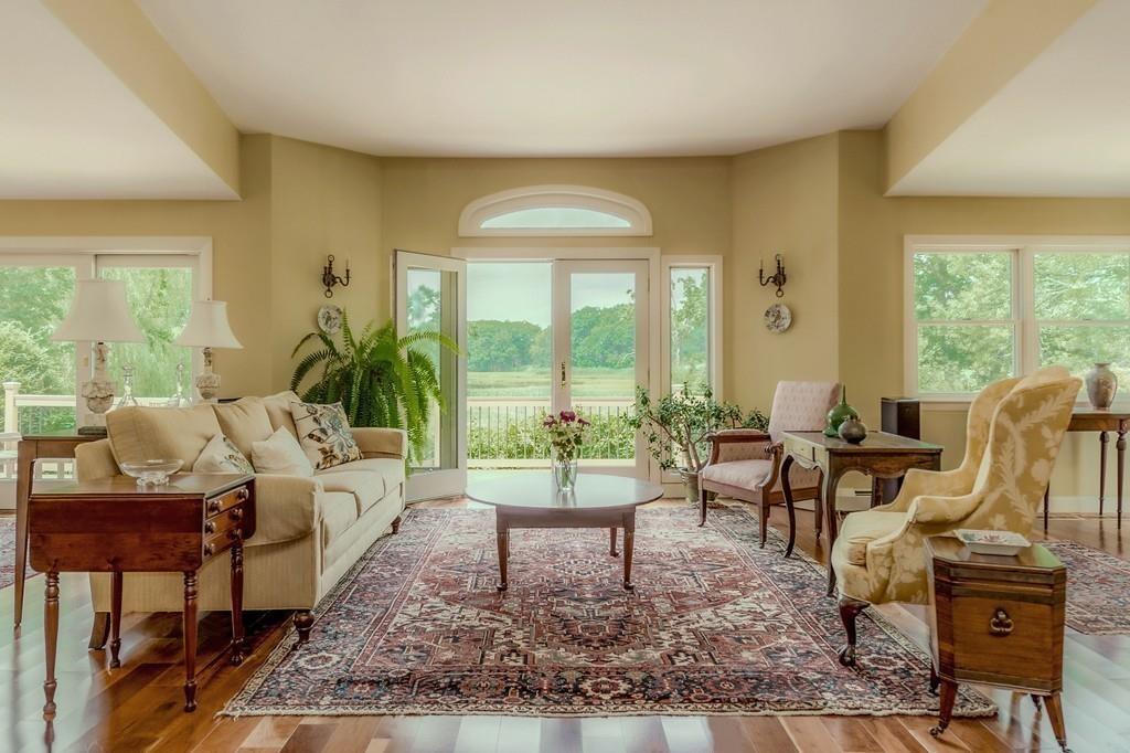 130 Argilla Road Ipswich, MA 01938 - Photo 8 of 42 a living room with furniture and a large window