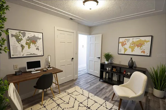 a view of a workspace with furniture