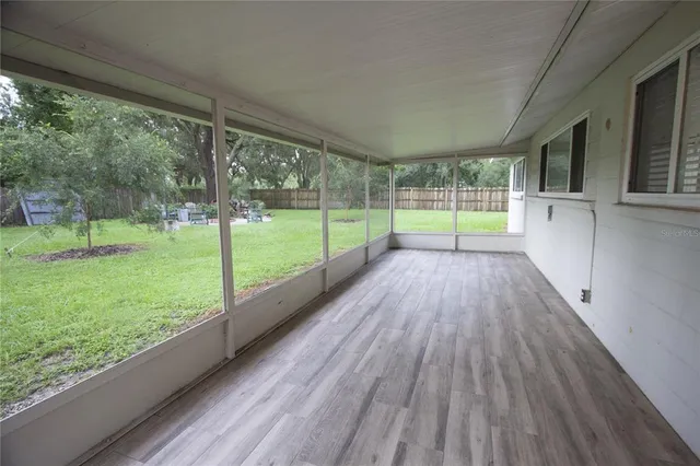 a view of outdoor space with deck and wooden floor