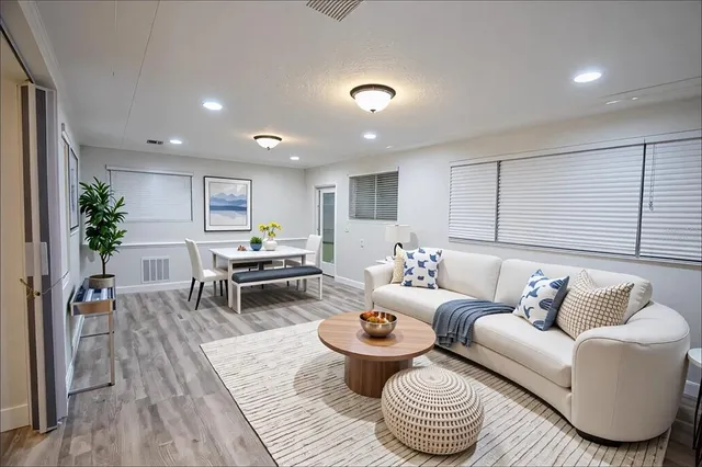 a living room with furniture and a table