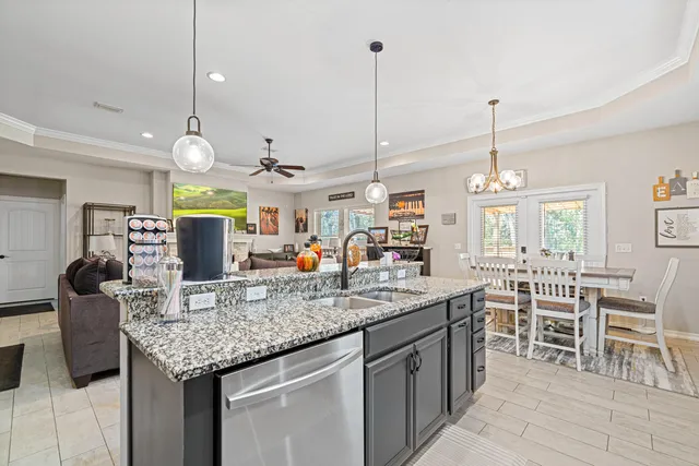 a kitchen with lots of counter space and windows