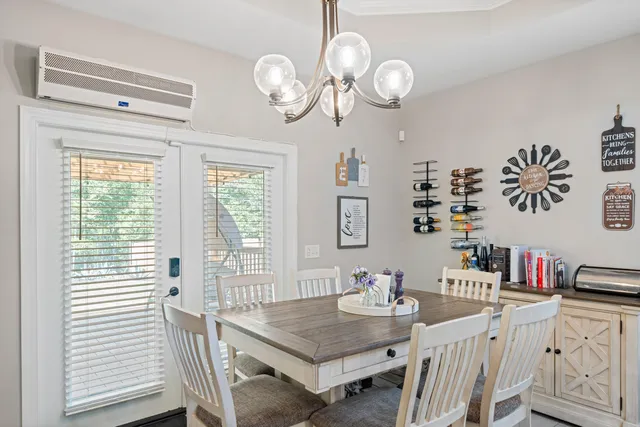 a view of a dining room that has a table and chairs