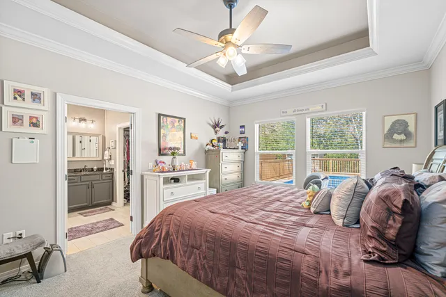 a spacious bedroom with a large bed and a large window