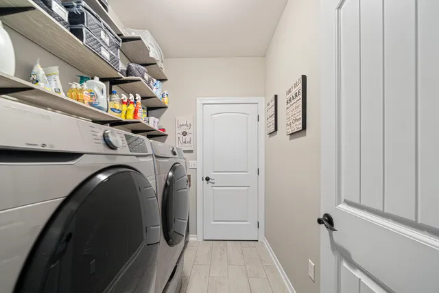 a utility room with dryer and washer