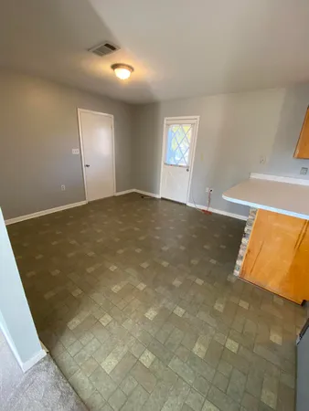 a view of an empty room and window