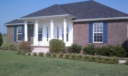 714 Lear Road Portland, TN 37148 - Photo 2 of 12 a front view of a house with garden