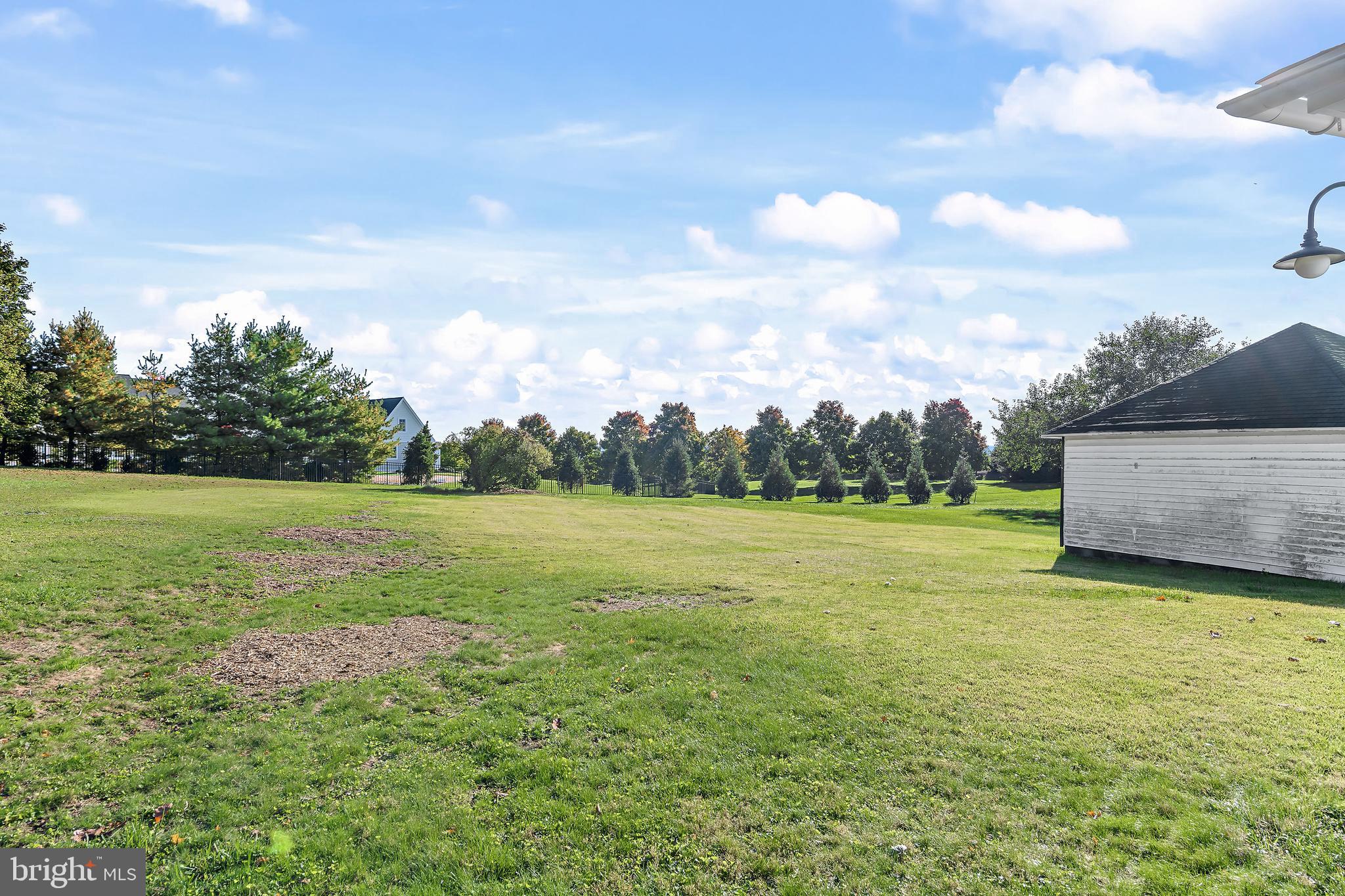 206 Hershey Road Hummelstown, PA 17036 - Photo 24 of 26 a view of a green field with wooden fence
