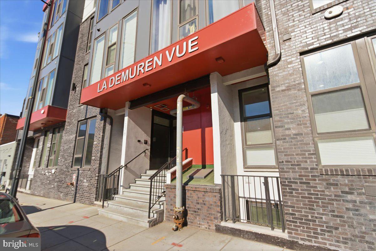 1028 Bladensburg Road Northeast, Unit 18 Washington, DC 20002 - Photo 1 of 22 a red brick building with glass windows