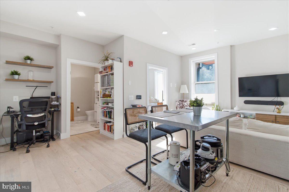 1028 Bladensburg Road Northeast, Unit 18 Washington, DC 20002 - Photo 6 of 22 a view of a workspace with furniture