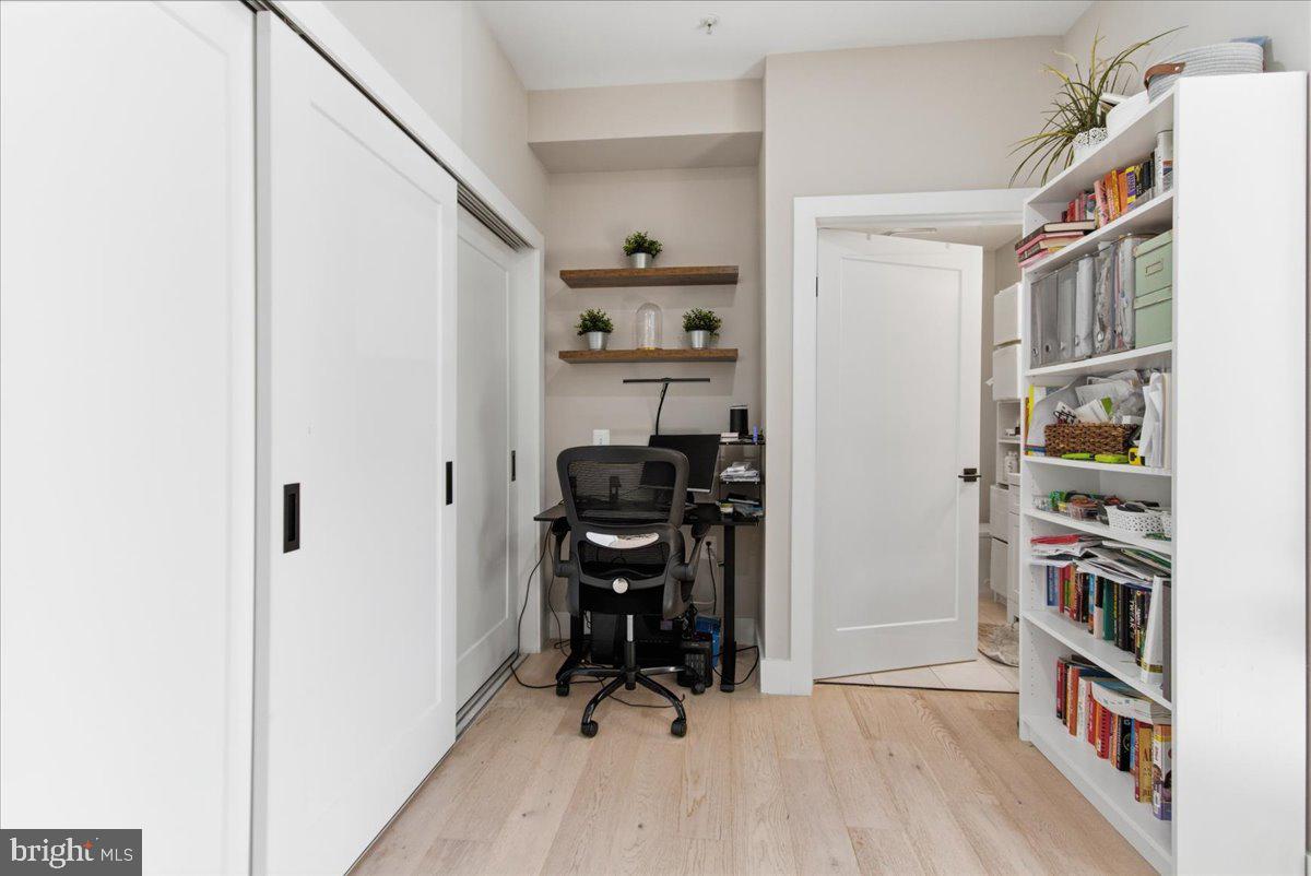 1028 Bladensburg Road Northeast, Unit 18 Washington, DC 20002 - Photo 9 of 22 a view of a workspace with furniture and wooden floor