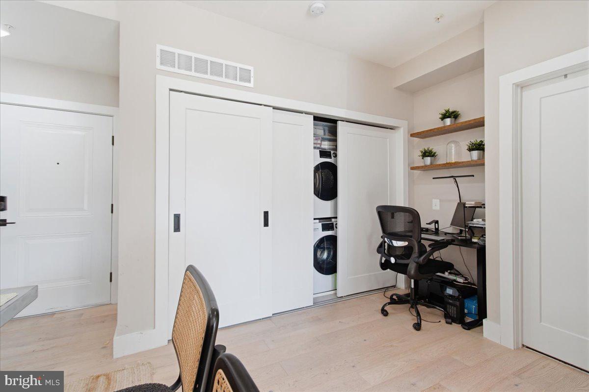 1028 Bladensburg Road Northeast, Unit 18 Washington, DC 20002 - Photo 10 of 22 a view of a workspace with furniture and a refrigerator