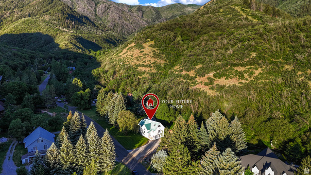 10686 South Covered Brg Cyn Road, Unit 14 Spanish Fork, UT 84660 - Photo 10 of 44 White multi-story residence with a light green roof, set among mature trees