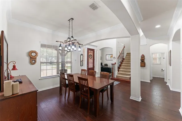 a view of a dining room with furniture and wooden floor
