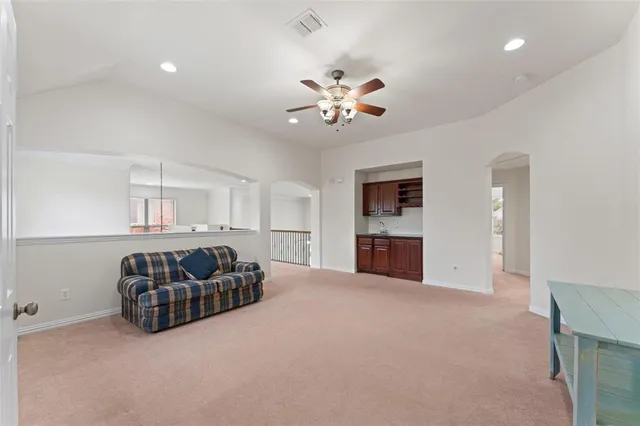 a living room with furniture and fireplace