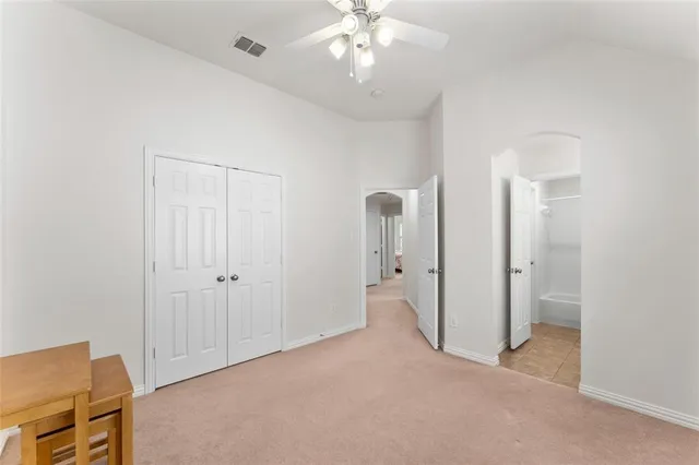 a view of a livingroom with a chandelier fan