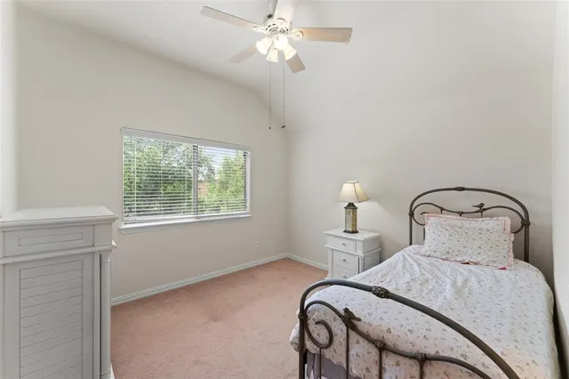 a bedroom with furniture and a window