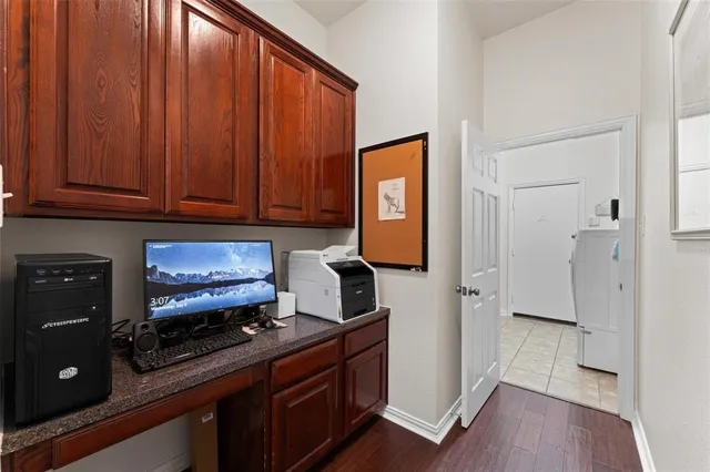 a kitchen with stainless steel appliances granite countertop wooden cabinets a stove a sink and a refrigerator