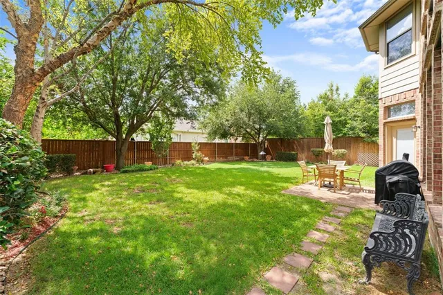 a view of a backyard with sitting area and furniture