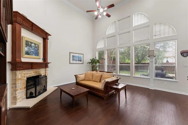 a living room with furniture wooden floor and a fireplace