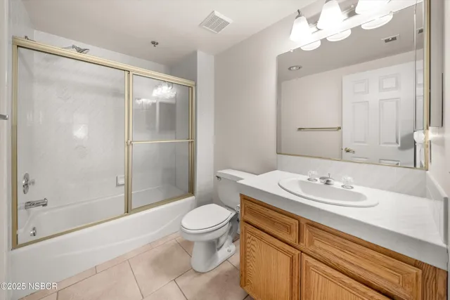 a bathroom with a double vanity sink mirror double and shower
