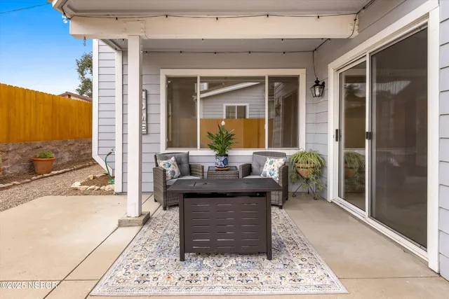 a living room with furniture and a rug