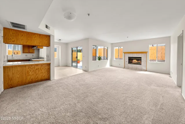 a view of a kitchen with a sink cabinets and a living room