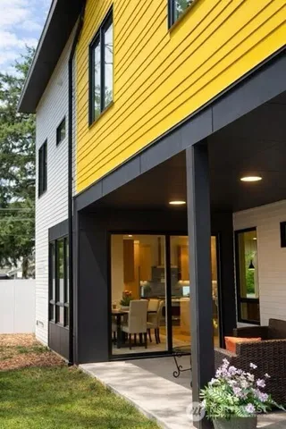 a view of a patio with table and chairs and potted plants