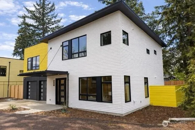 a front view of a house with a garage