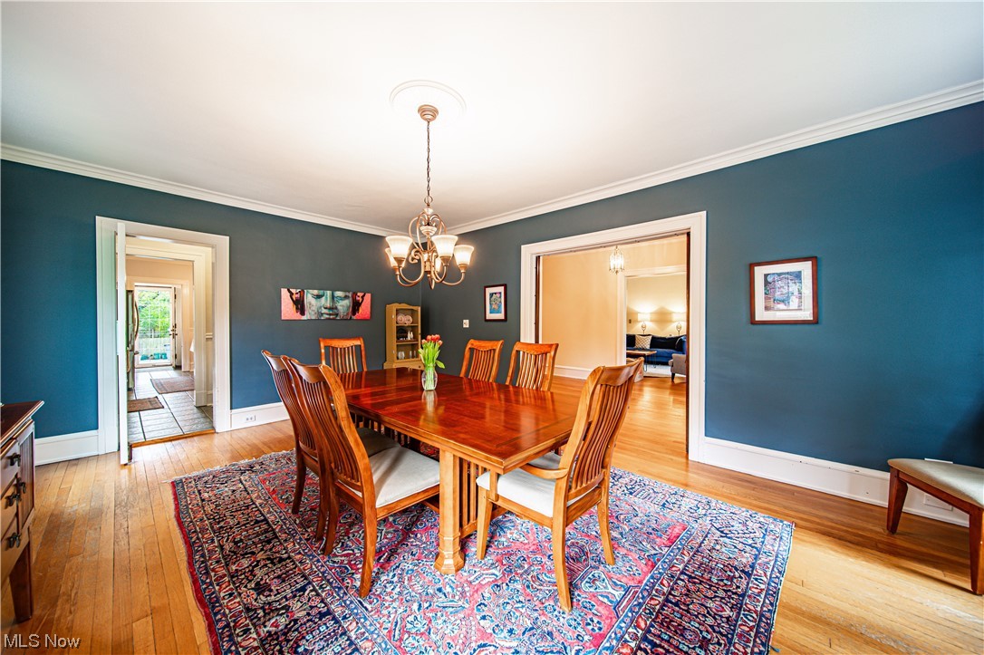 2868 Lee Road Cleveland, OH 44120 - Photo 5 of 35 Dining space featuring ornamental molding and beautiful hardwood floors.
