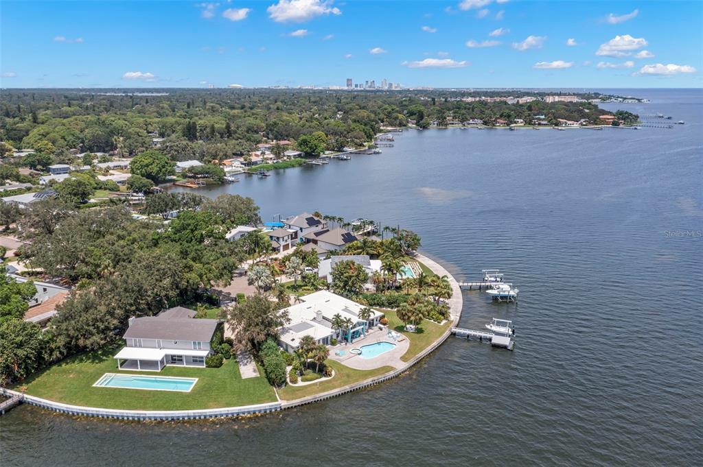 200 Colony Point Road South St. Petersburg, FL 33705 - Photo 1 of 1 an aerial view of a house with a yard and lake view
