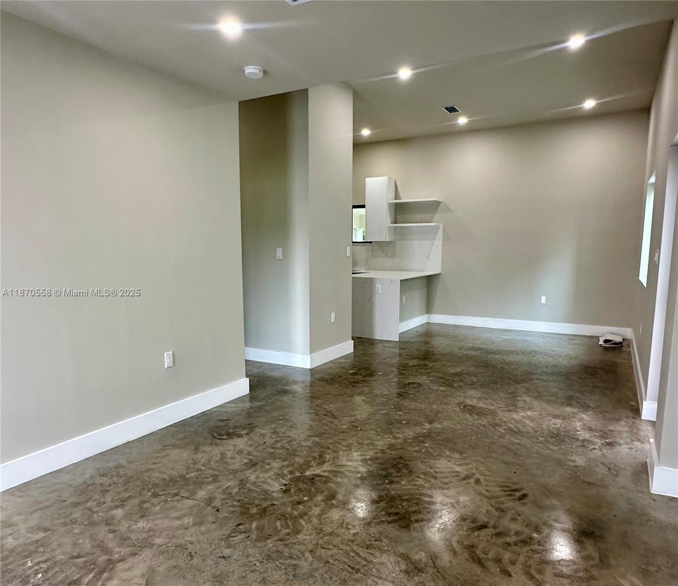 929 Northwest 60th Street Miami, FL 33127 - Photo 20 of 58 a view of a refrigerator and window in a room