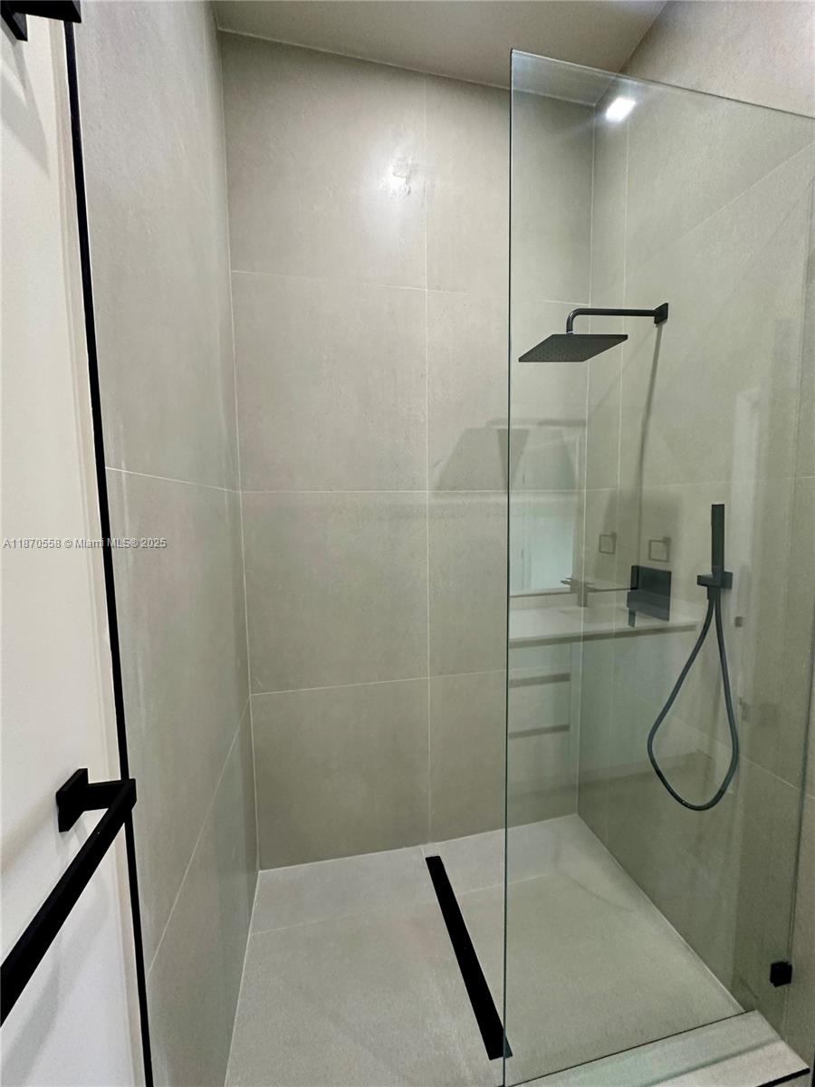 929 Northwest 60th Street Miami, FL 33127 - Photo 36 of 58 a bathroom with a shower