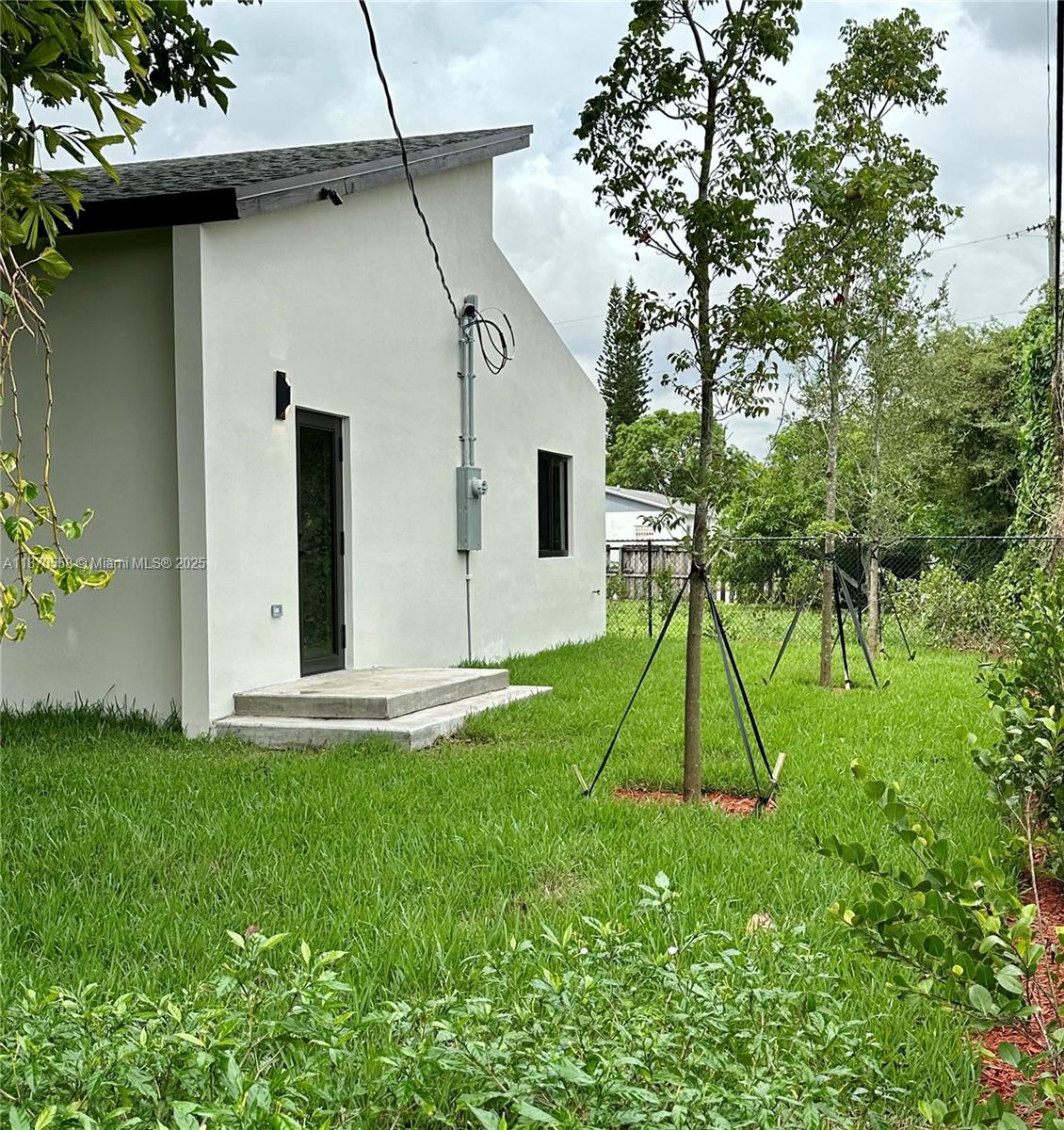 929 Northwest 60th Street Miami, FL 33127 - Photo 42 of 58 a house view with a backyard