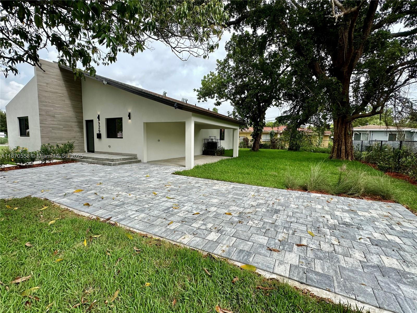 929 Northwest 60th Street Miami, FL 33127 - Photo 48 of 58 a view of a house with a yard