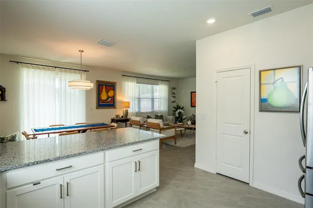 a kitchen with stainless steel appliances a refrigerator stove and microwave