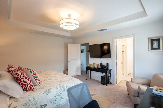 a bedroom with a bed and a couch